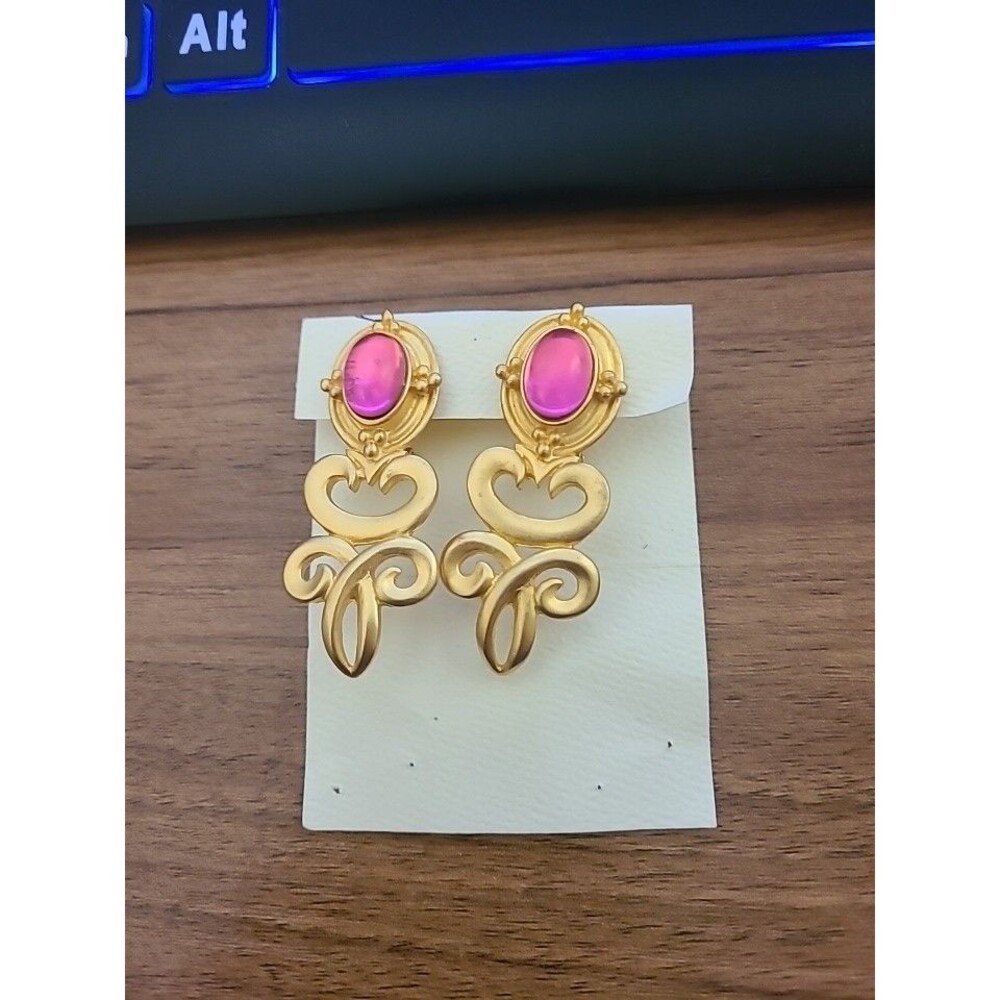 vintage gold tone clip on earrings with red tear shaped acrylic accents